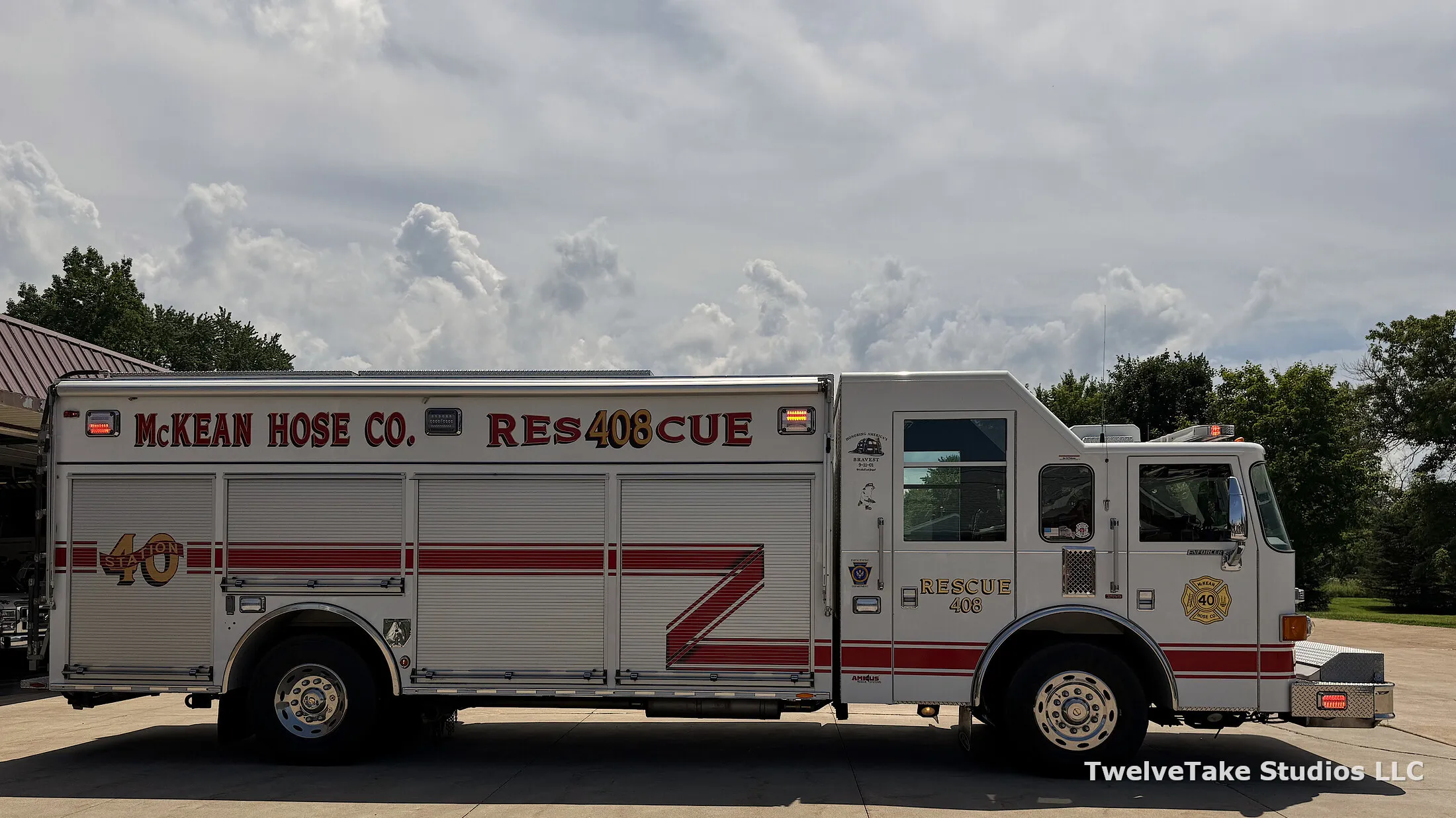 Full side view of Rescue 408, its roll-up compartment doors closed, showing the body that opens all the way around and the McKEAN HOSE CO. RESCUE 408 lettering across the full length.
